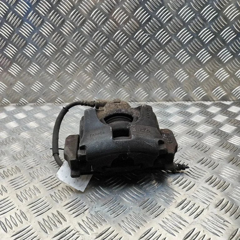 Front brake caliper 6G912B294AC