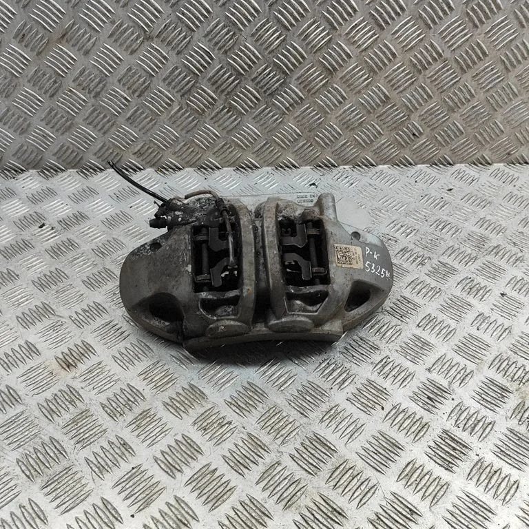 Zacisk hamulcowy przedni 80A615105CF