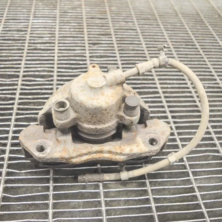 Front brake caliper – left