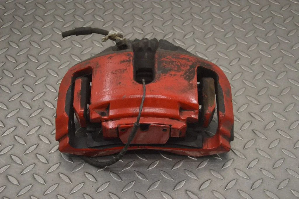 Front brake caliper – left