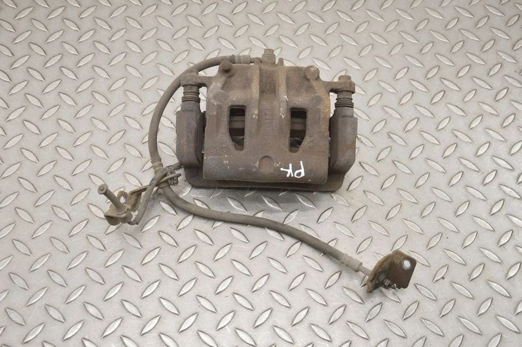 Front brake caliper – left