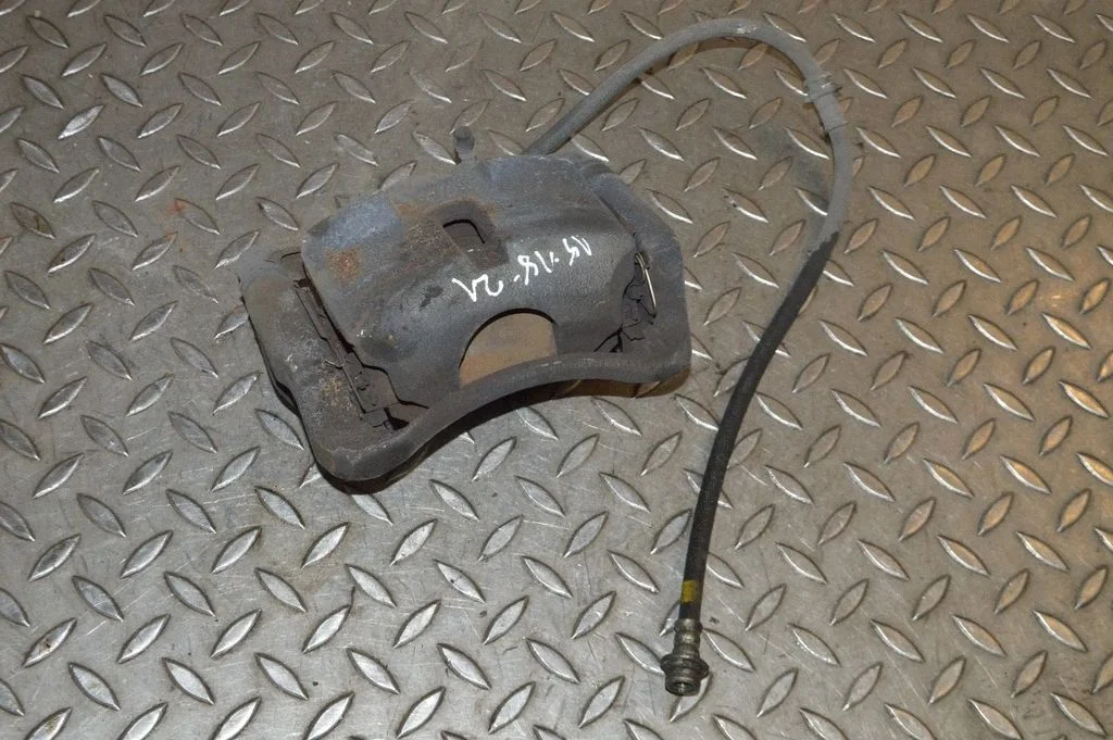 Front brake caliper – left