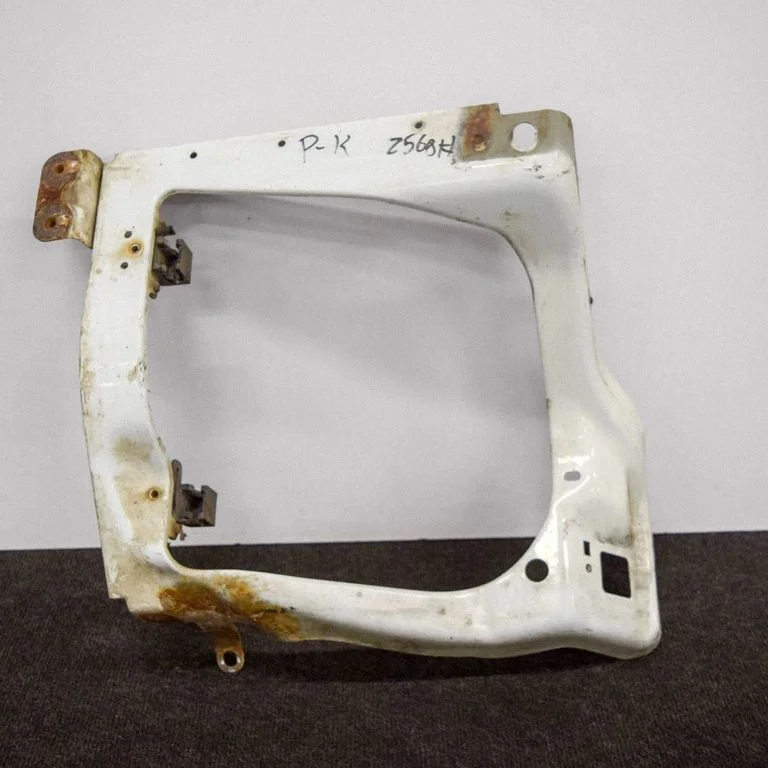 Headlight/headlamp mounting bracket 7C1113K020AA