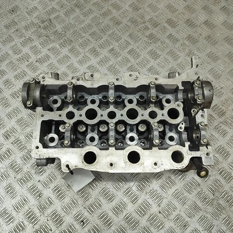 Engine head PM9X2Q6C064DA