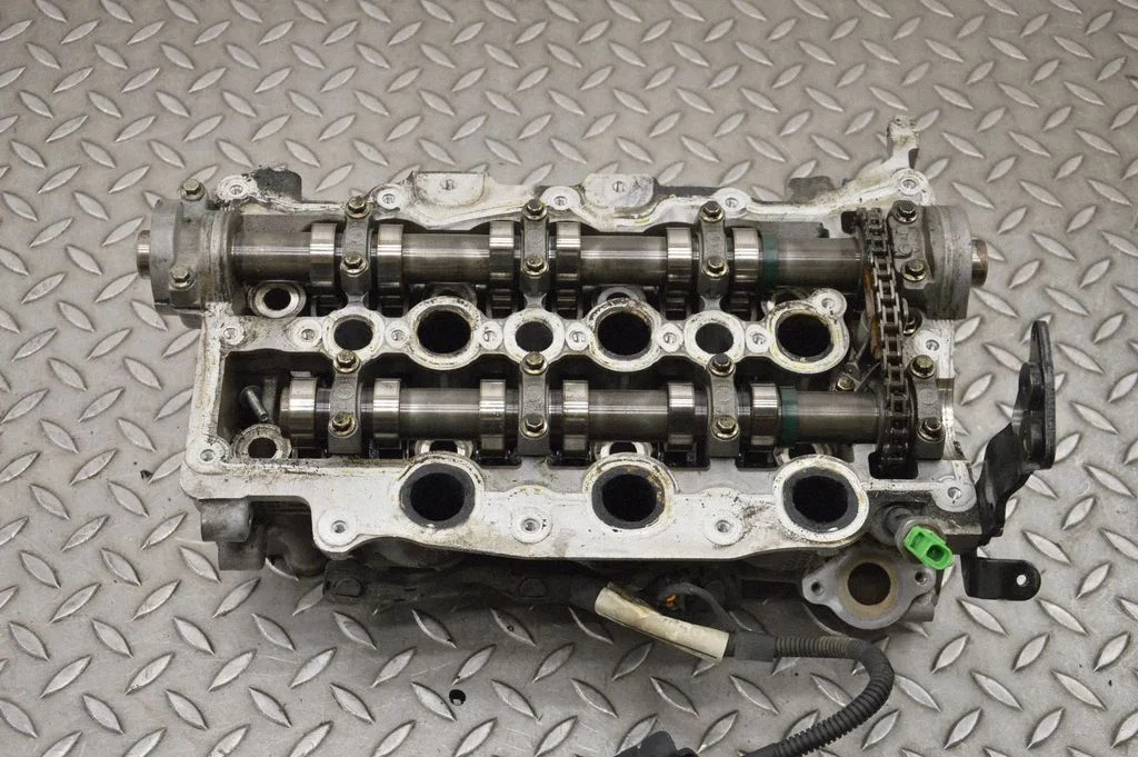 Engine head PM9X2Q6C064DA