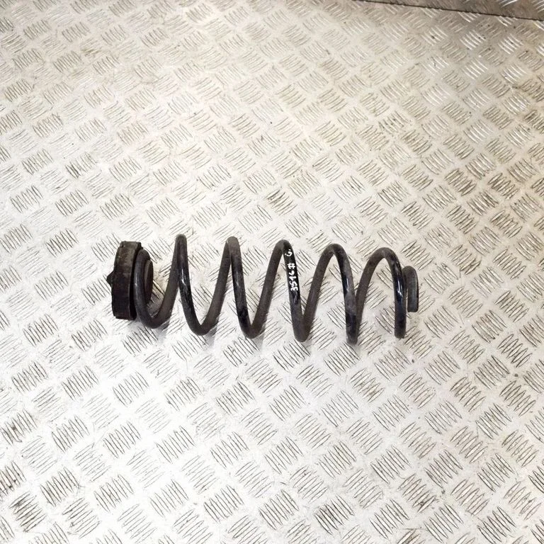 Rear coil spring – left