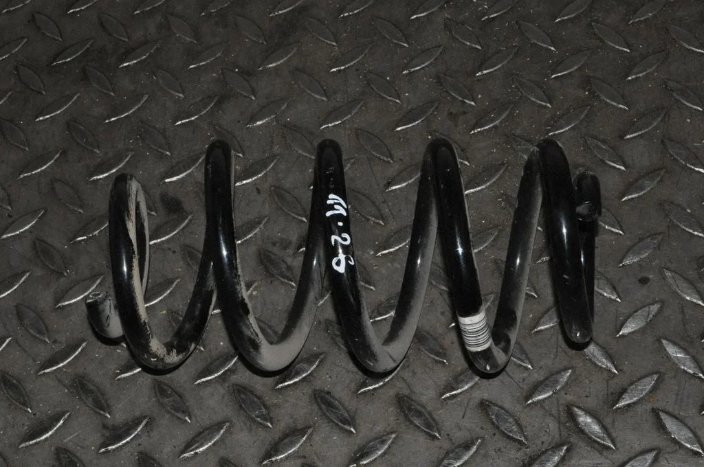 Rear coil spring – left