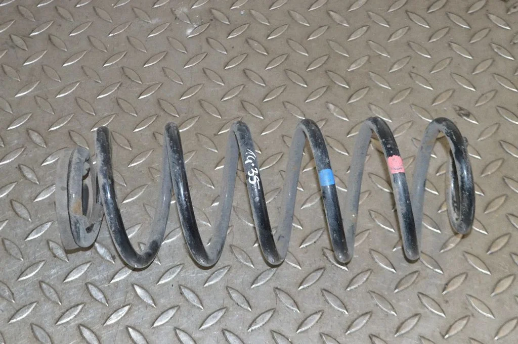 Rear coil spring – left