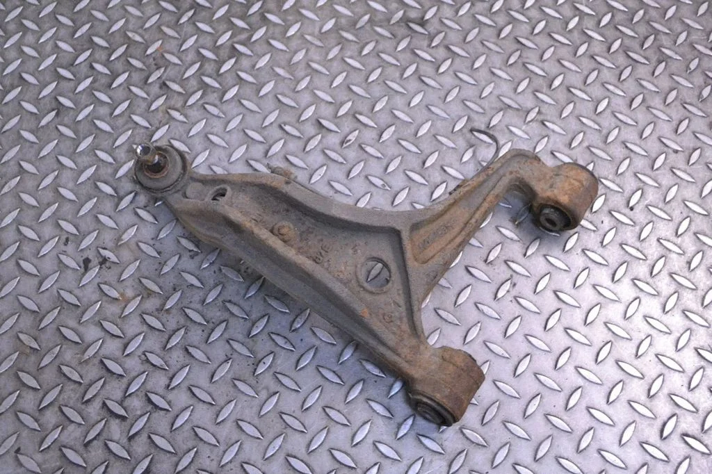 Rear upper control arm/wishbone – left