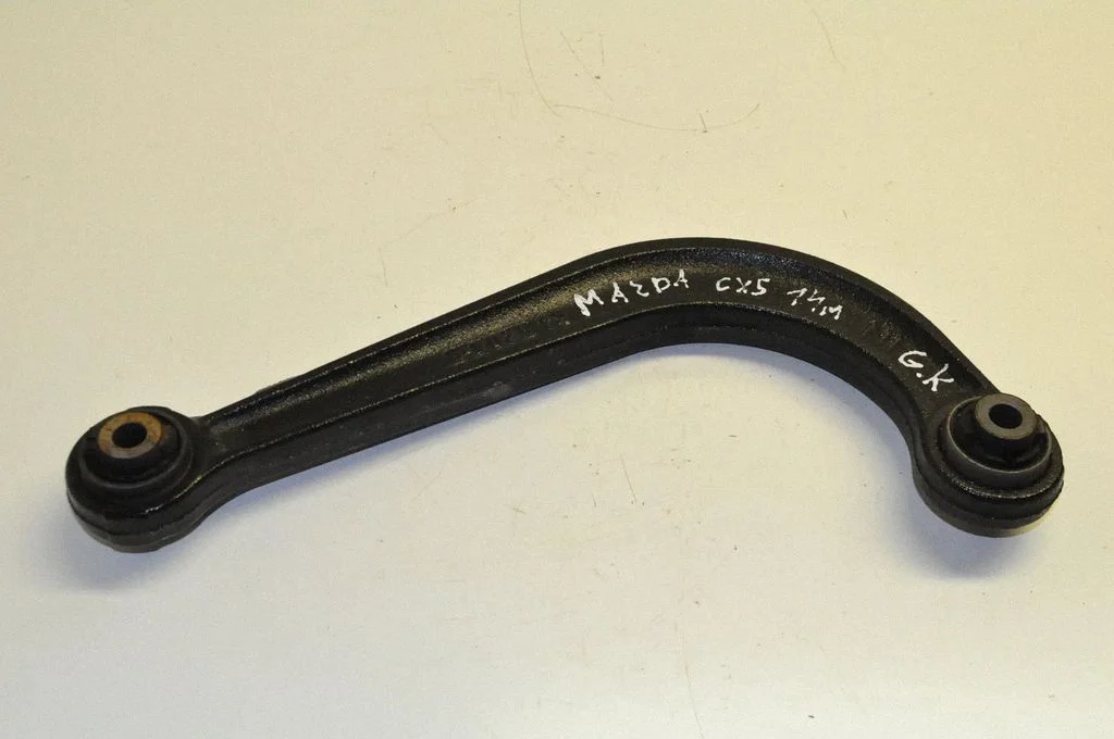 Rear upper control arm/wishbone – left