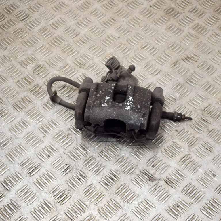 Rear brake caliper – left