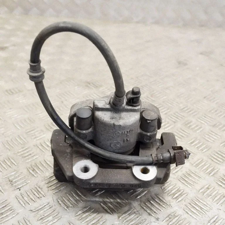 Rear brake caliper – left