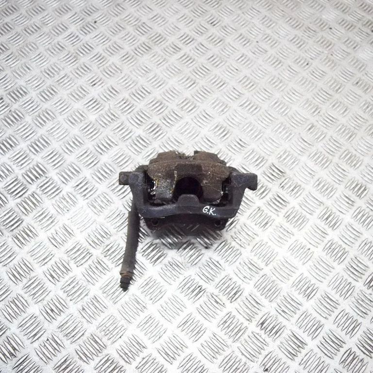 Rear brake caliper – left