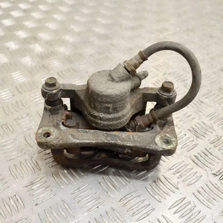 Rear brake caliper – left