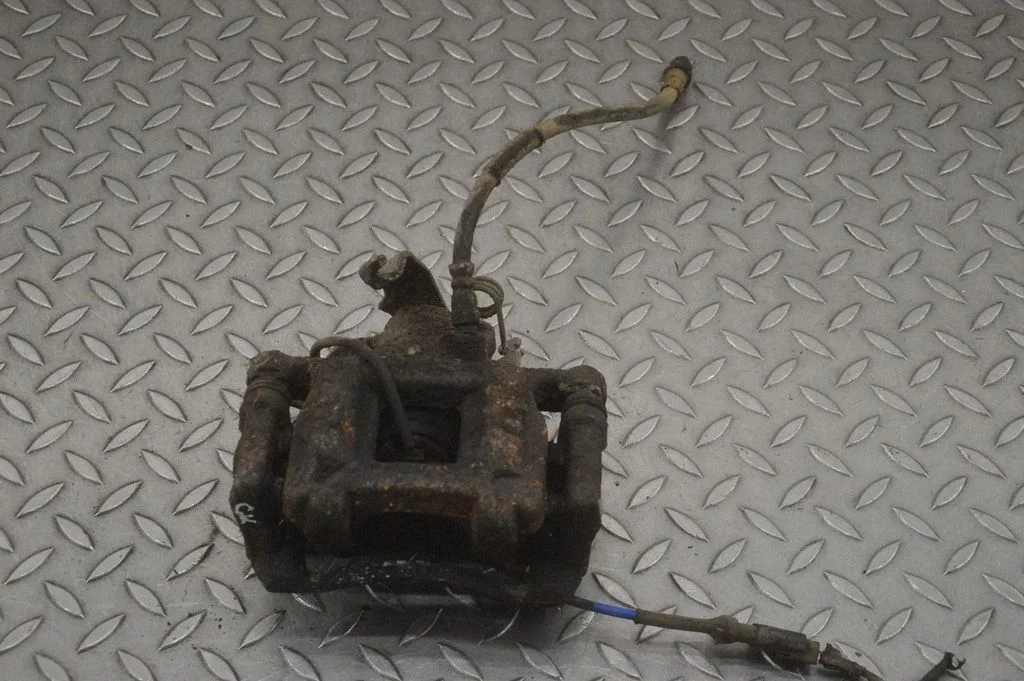 Rear brake caliper – left