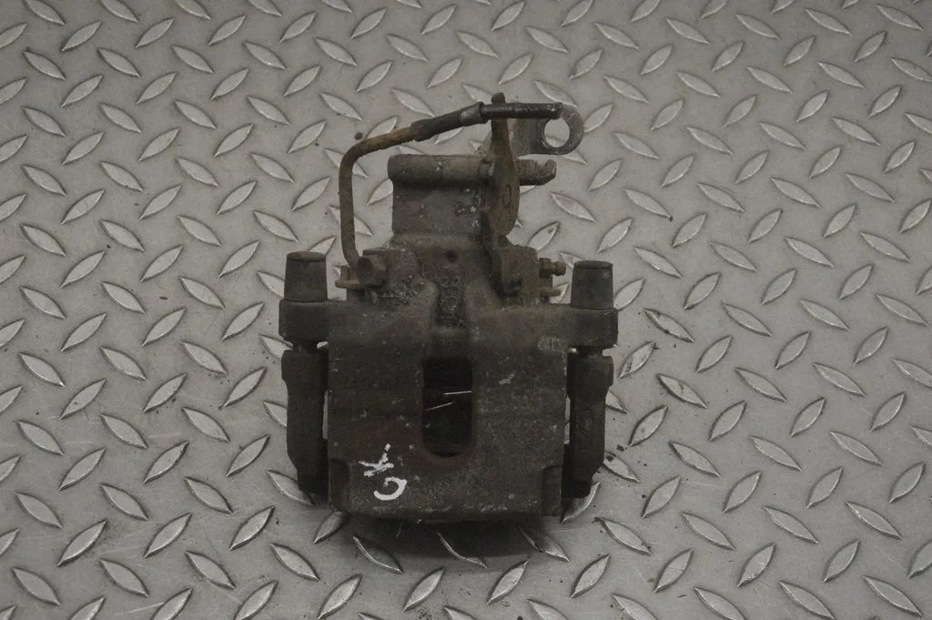 Rear brake caliper – left