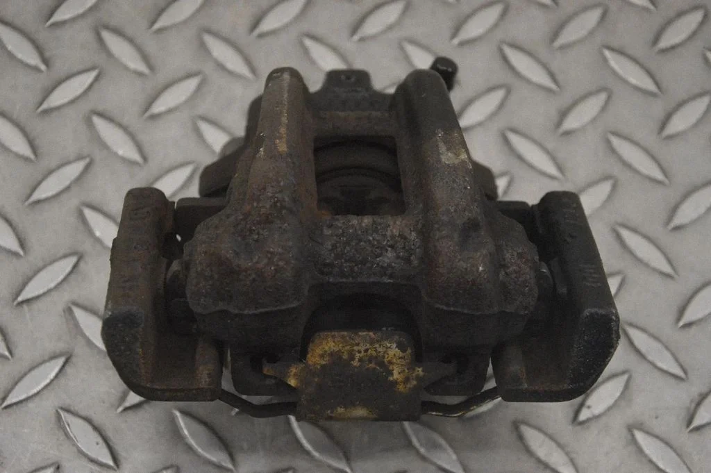 Rear brake caliper – left