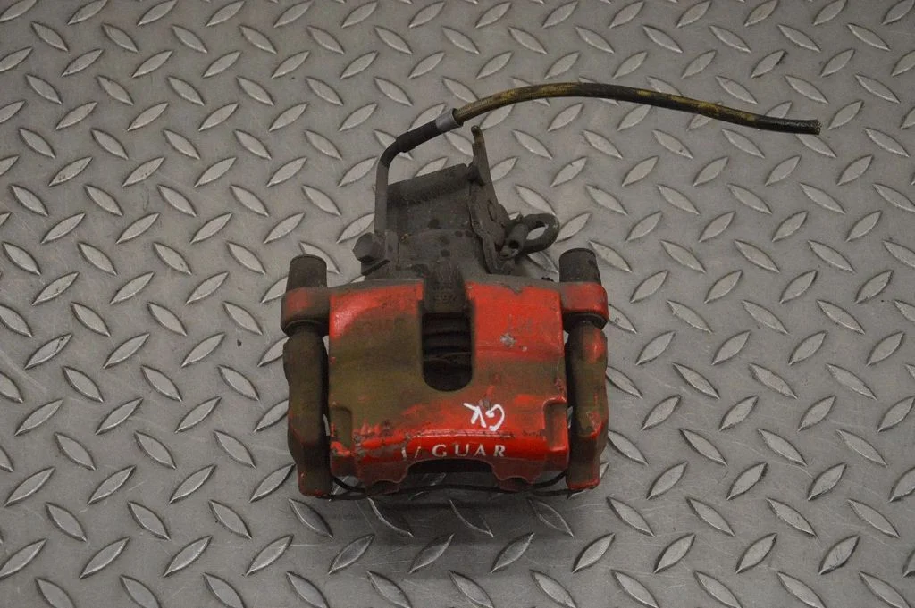 Rear brake caliper – left