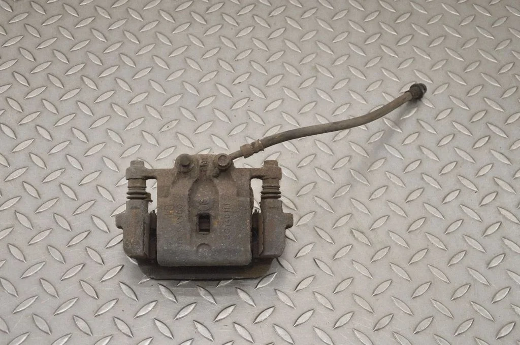 Rear brake caliper – left