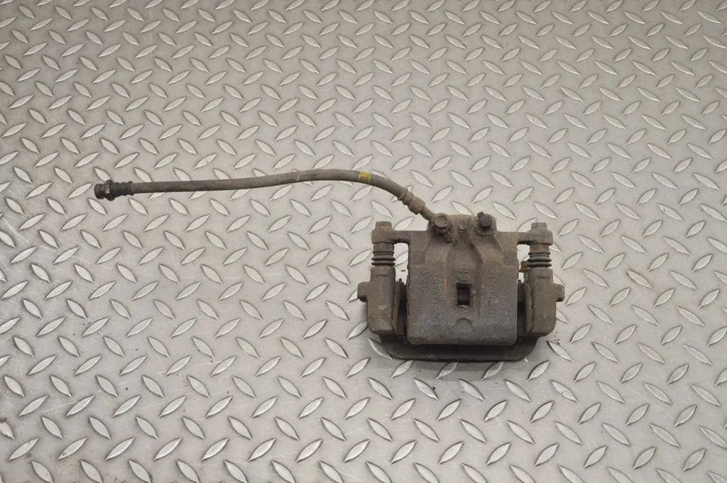 Rear brake caliper – right