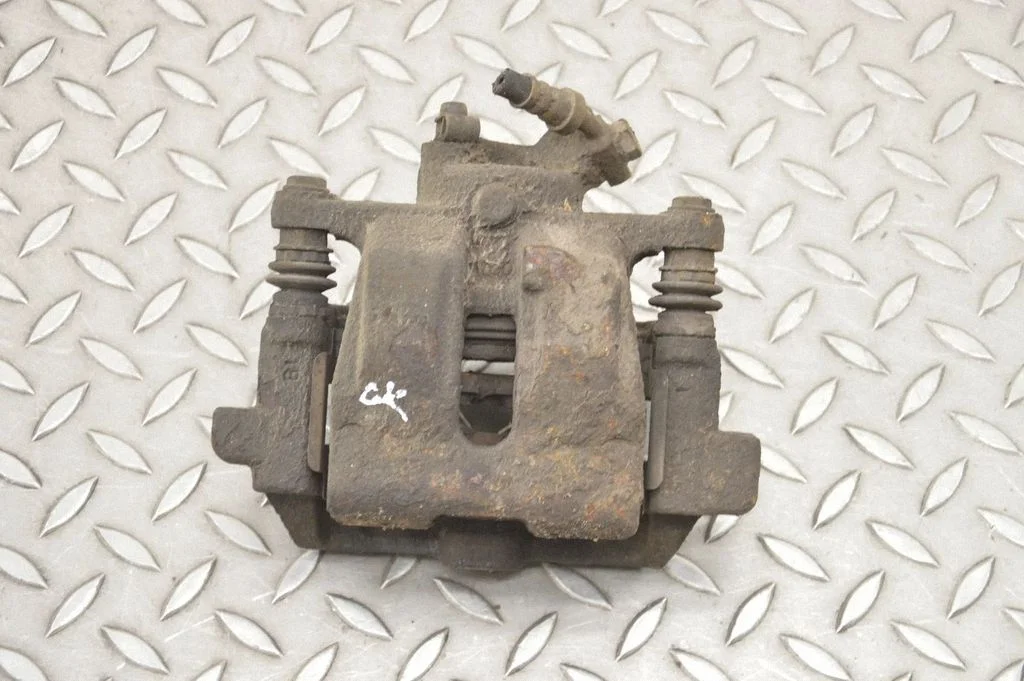 Rear brake caliper – left
