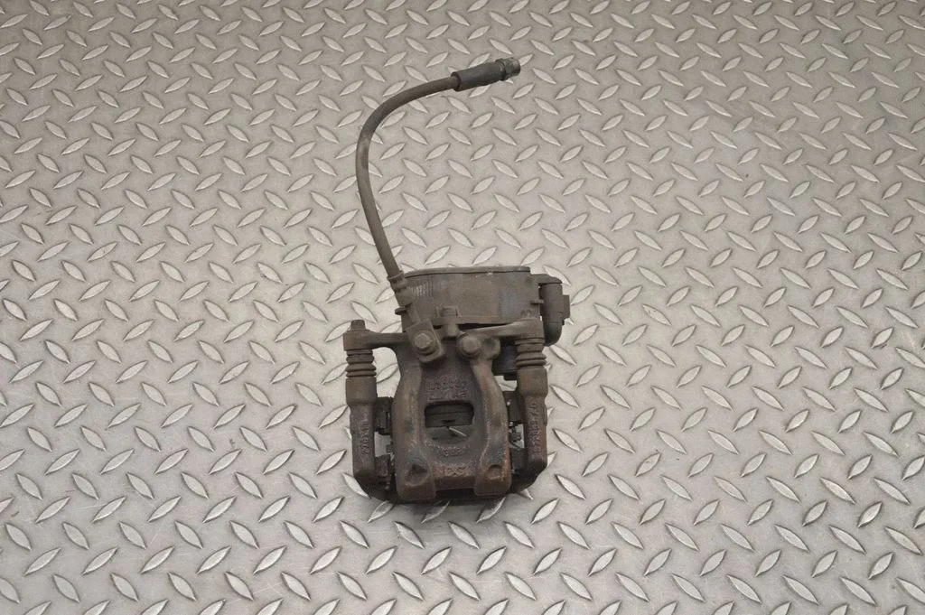 Rear brake caliper – right