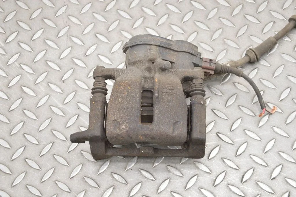 Rear brake caliper – left