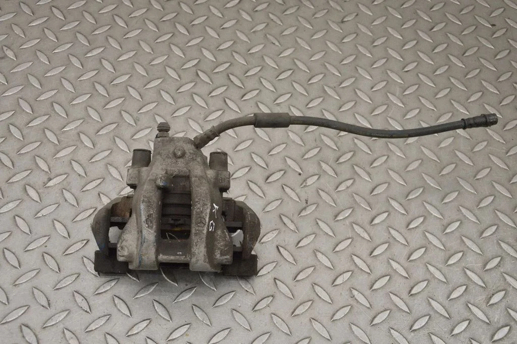 Rear brake caliper – left