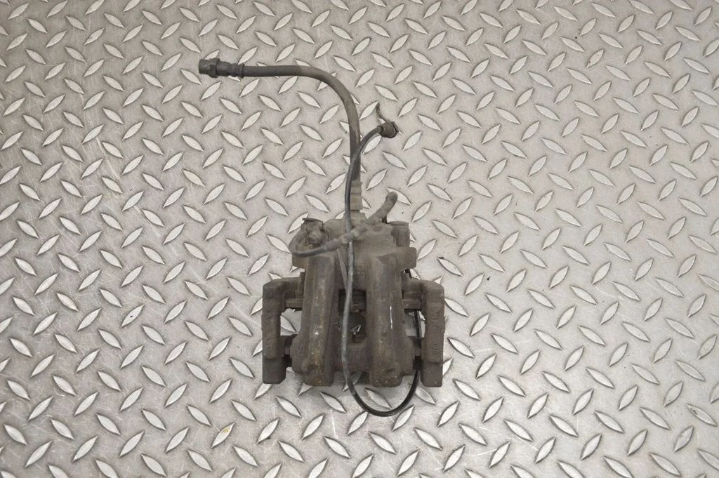 Rear brake caliper – right