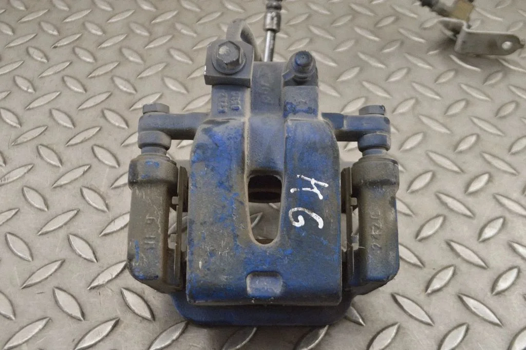 Rear brake caliper – left