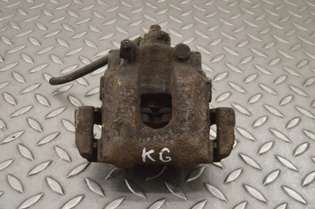 Rear brake caliper – left