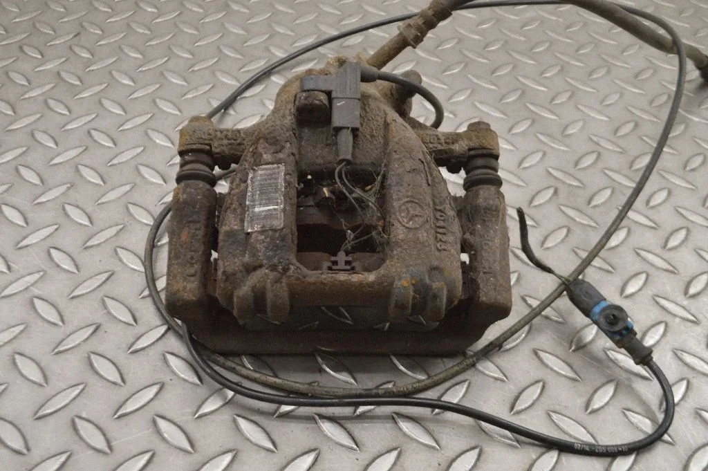 Rear brake caliper – left
