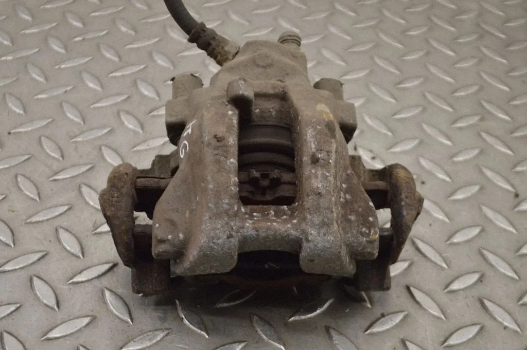 Rear brake caliper – left