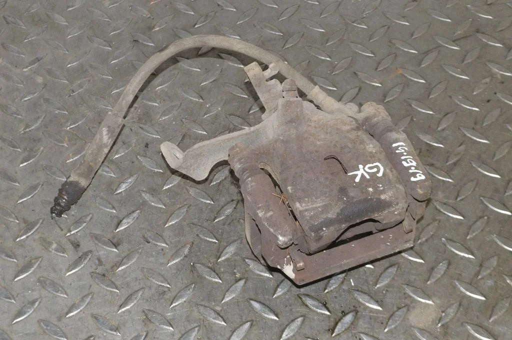 Rear brake caliper – left