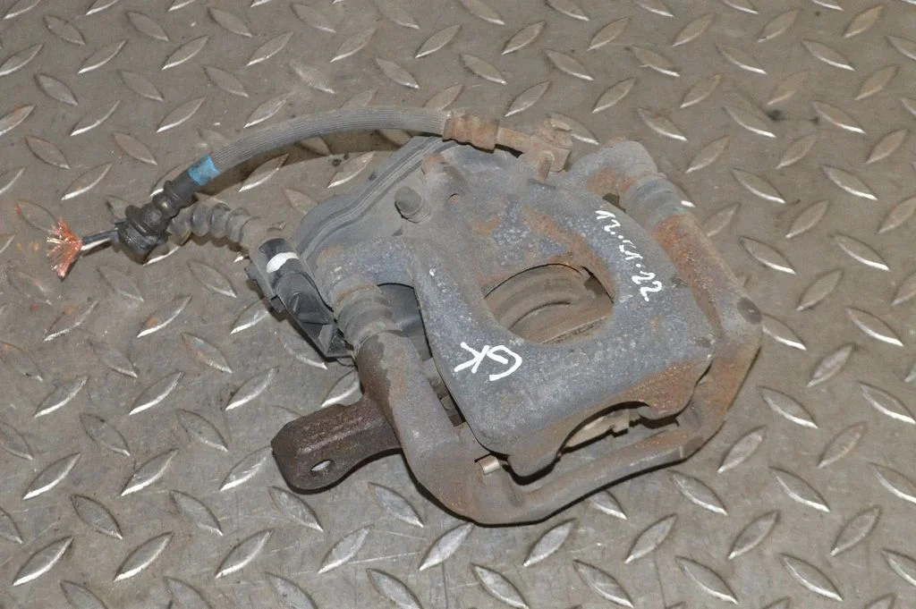 Rear brake caliper – left