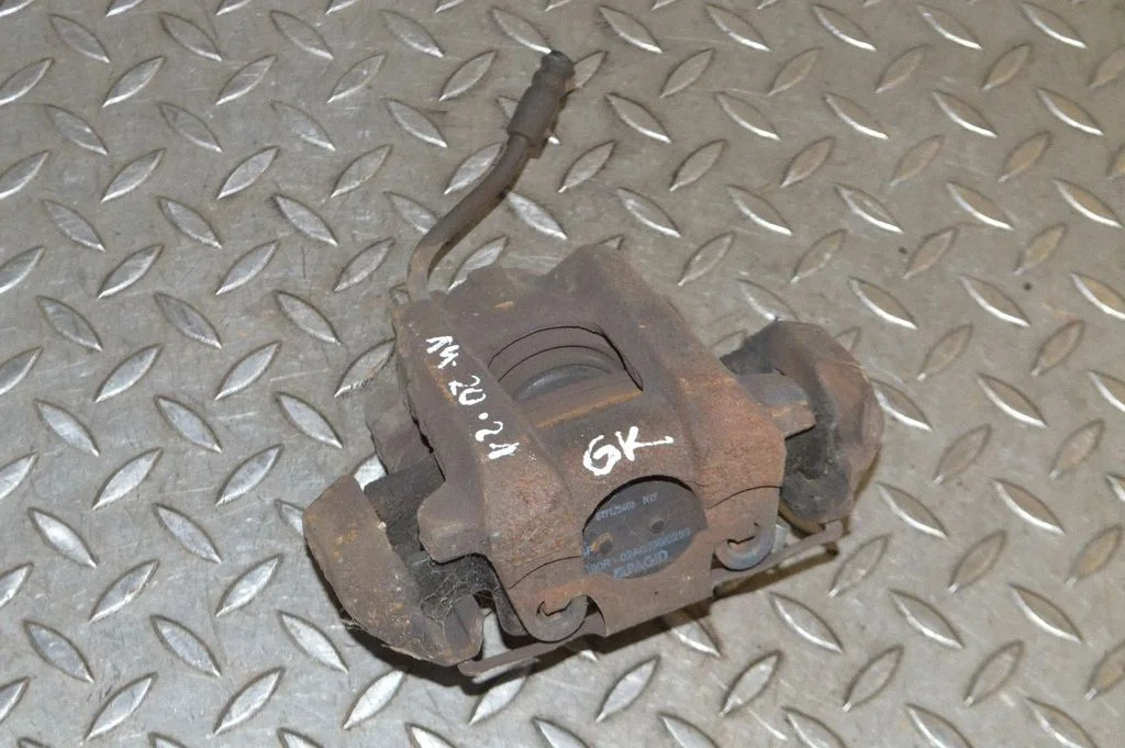 Rear brake caliper – left
