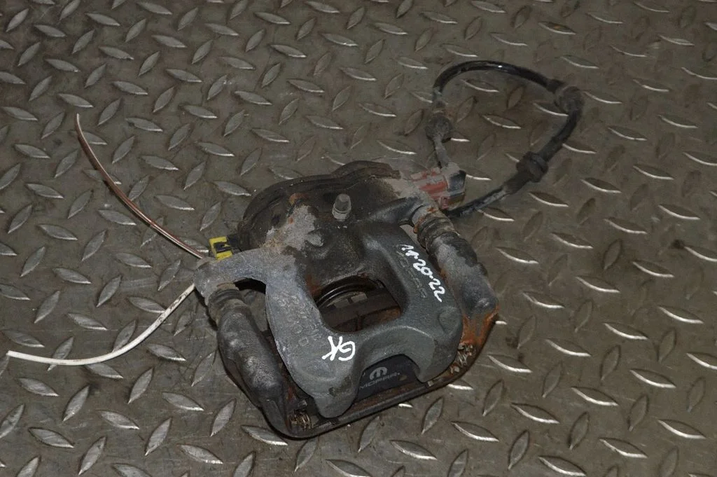 Rear brake caliper – left