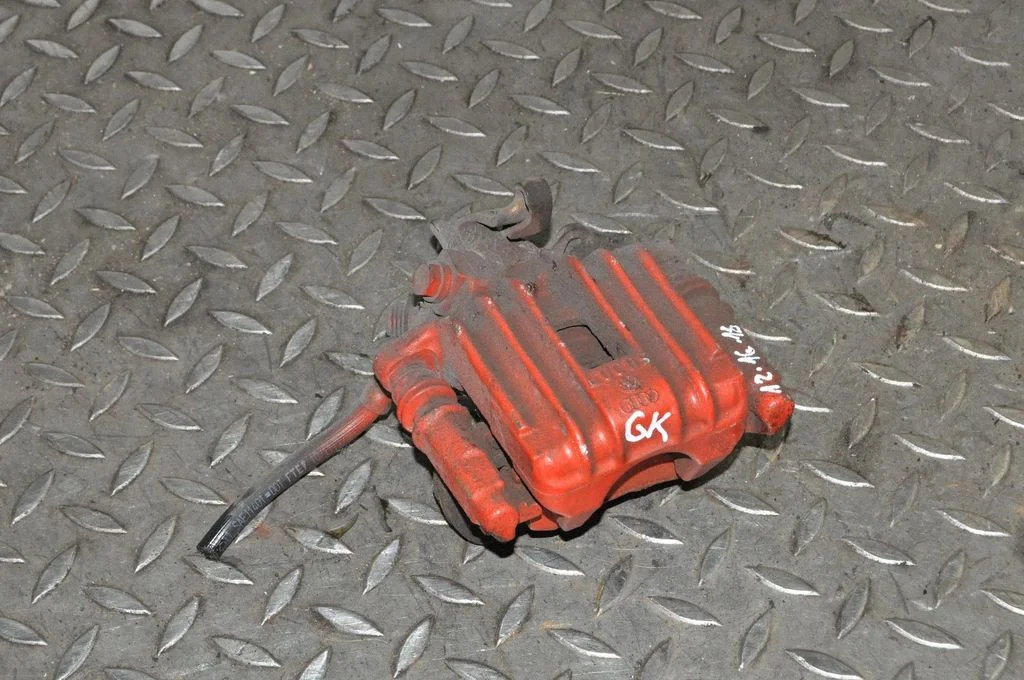 Rear brake caliper – left