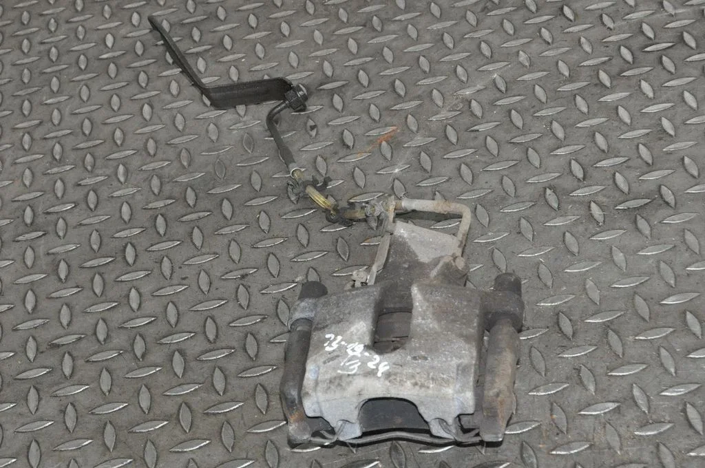 Rear brake caliper – left