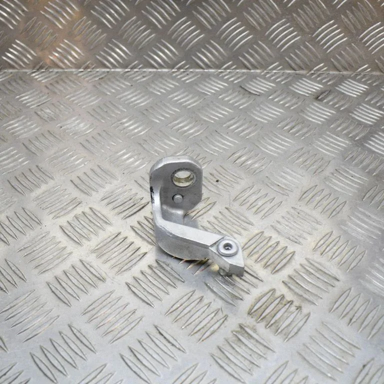 Front door upper hinge – left