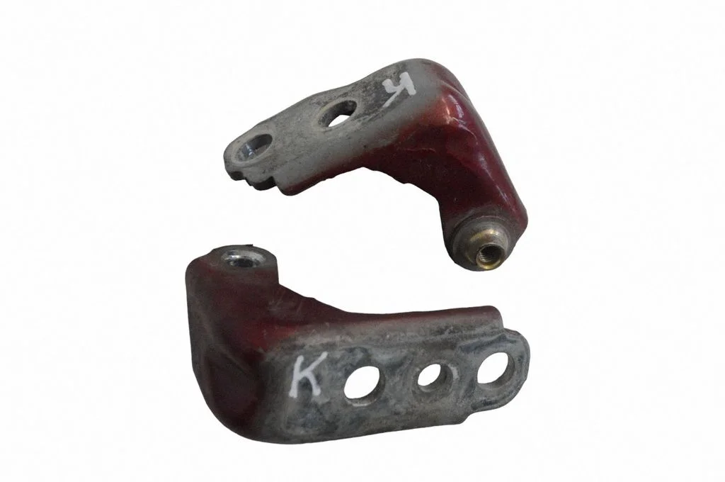 Front door upper hinge – left
