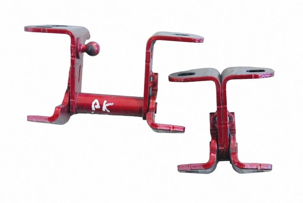 Front door upper hinge – left