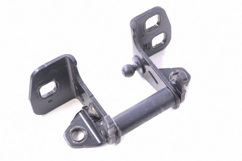 Front door upper hinge – left