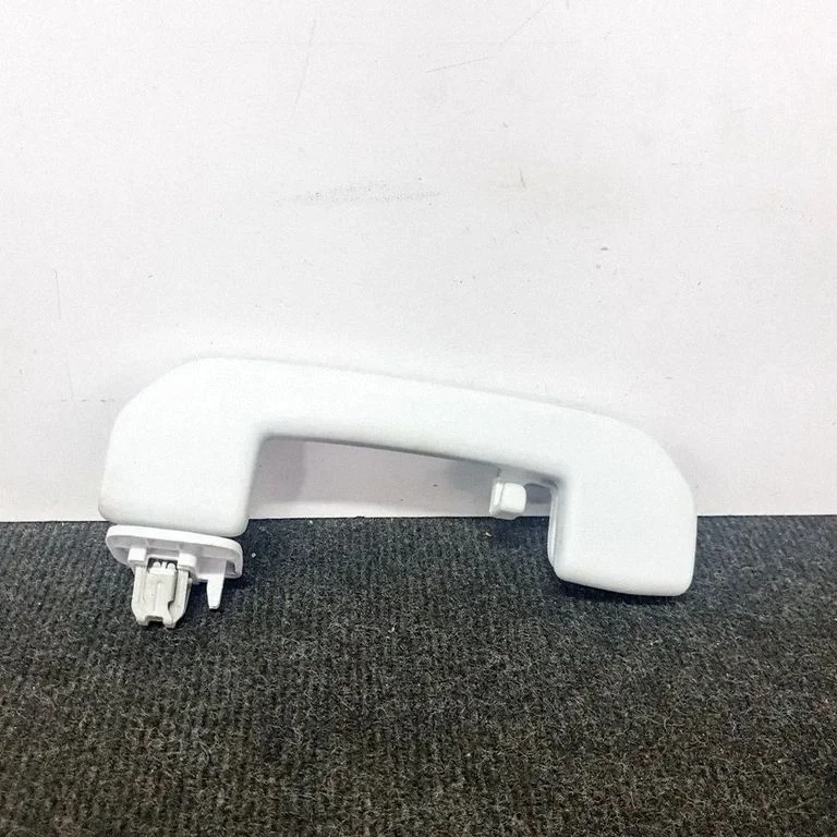 Rear interior roof grab handle – left