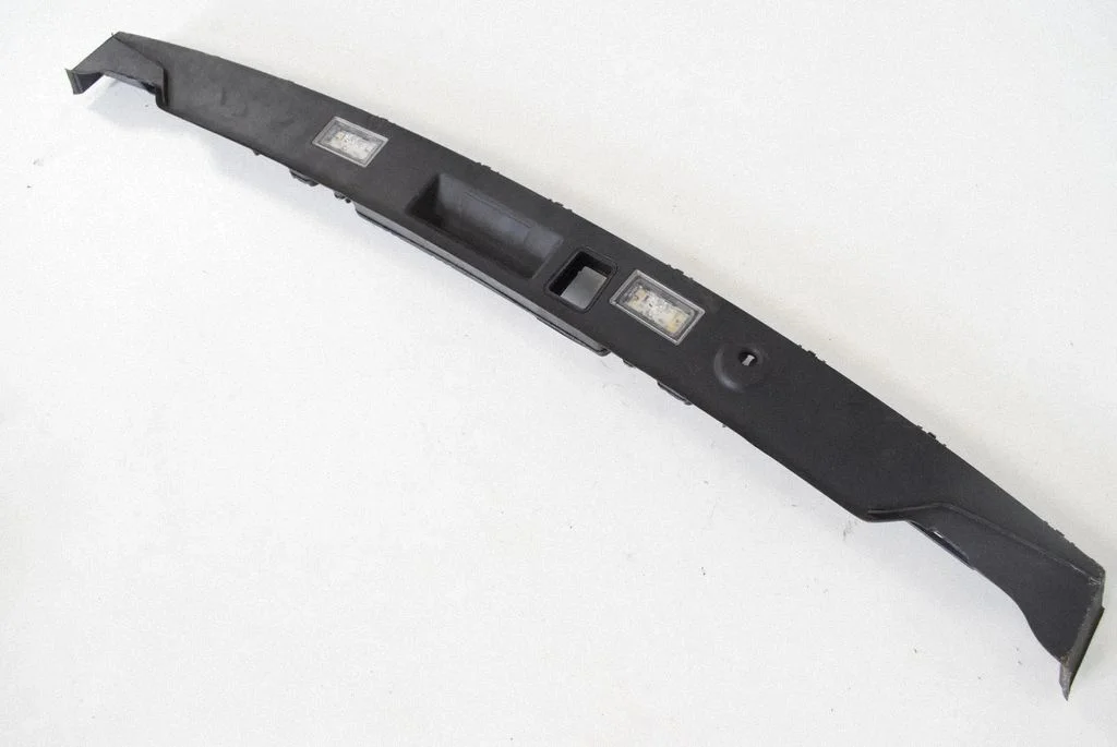 Trunk door license plate light bar 7200035