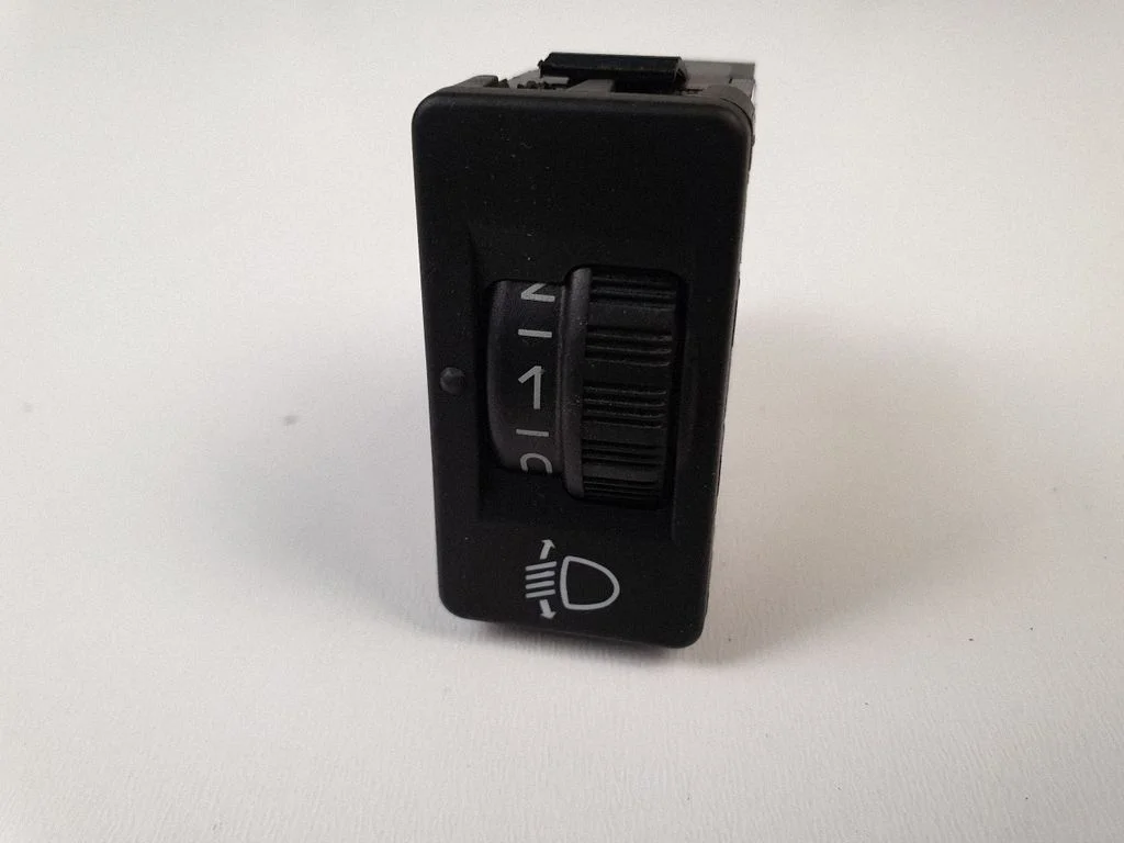 Headlight level height control switch