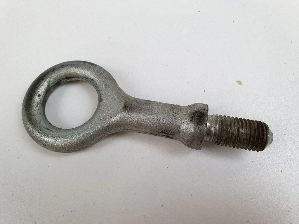 Towing hook eye