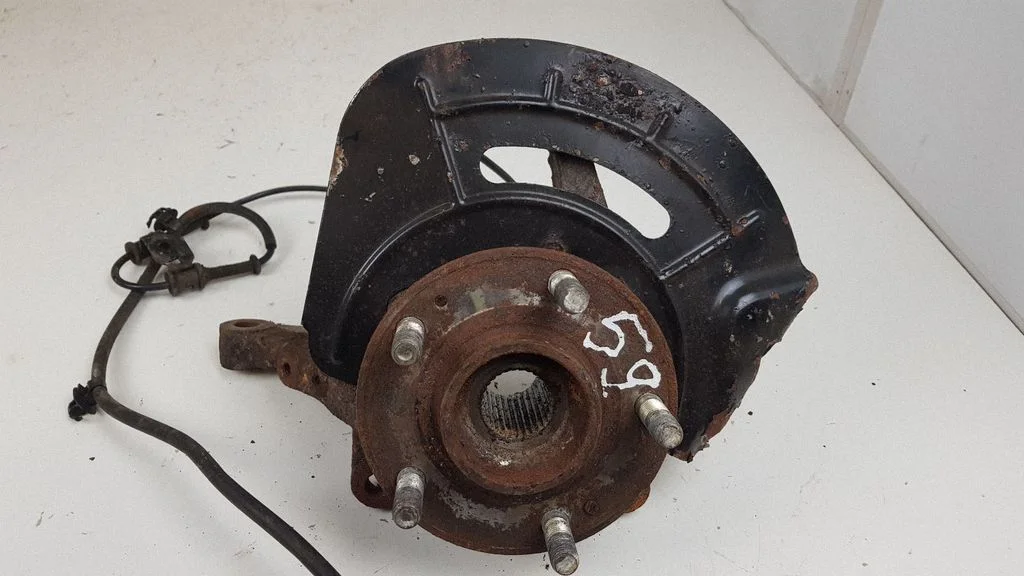 Front wheel hub spindle knuckle – front left