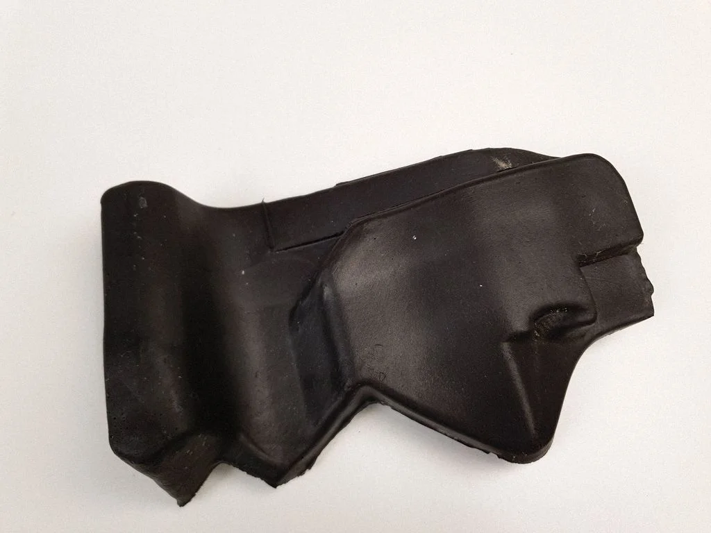 Other engine bay part – left