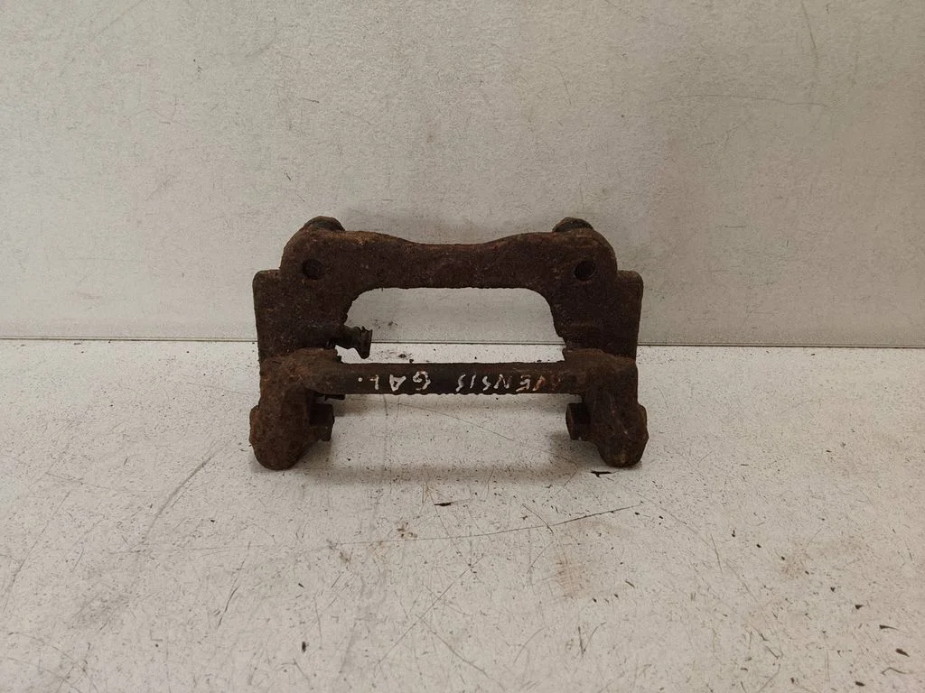 Brake caliper pad carrier rear – left